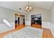 Dining room featuring hardwood floors, white trim, and view into other living spaces at 1627 Amhearst Walk Rd, Lawrenceville, GA 30043