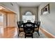 Dining room features hardwood floors, a large dining table, and a large arched window at 1627 Amhearst Walk Rd, Lawrenceville, GA 30043