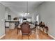 Dining room featuring hardwood floors and a view into the Gathering room and kitchen at 1627 Amhearst Walk Rd, Lawrenceville, GA 30043