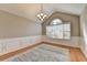Bright dining room featuring a chandelier, hardwood floors, and a large window at 1627 Amhearst Walk Rd, Lawrenceville, GA 30043