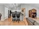 Kitchen featuring stainless steel appliances, a breakfast bar, and hardwood floors at 1627 Amhearst Walk Rd, Lawrenceville, GA 30043