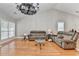 Open living room showcasing hardwood floors, high ceilings, and ample seating at 1627 Amhearst Walk Rd, Lawrenceville, GA 30043