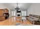 Spacious living room with hardwood floors, a fireplace, and plenty of natural light at 1627 Amhearst Walk Rd, Lawrenceville, GA 30043