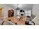 Living room with hardwood floors, fireplace, and an elegant chandelier enhancing the room's style at 1627 Amhearst Walk Rd, Lawrenceville, GA 30043