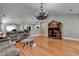 Spacious living room with hardwood floors, vaulted ceilings, and modern lighting at 1627 Amhearst Walk Rd, Lawrenceville, GA 30043