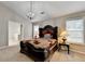 Cozy main bedroom with a large bed, pendant lighting, and ample natural light at 1627 Amhearst Walk Rd, Lawrenceville, GA 30043