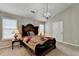 Lovely bedroom featuring carpet flooring, a large bed, and bright windows at 1627 Amhearst Walk Rd, Lawrenceville, GA 30043