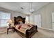 Inviting bedroom with neutral walls, carpet flooring, and decorative lighting at 1627 Amhearst Walk Rd, Lawrenceville, GA 30043