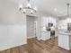 Dining area with hardwood flooring and view of kitchen featuring stainless steel appliances at 1847 Davis Mill Rd, Dallas, GA 30157