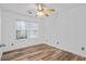 Cozy bedroom with a window offering natural light and durable wood-look flooring at 300 Lakeside Dr, Covington, GA 30016