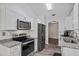 Modern kitchen with stainless steel appliances and beautiful granite countertops at 300 Lakeside Dr, Covington, GA 30016