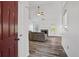 Inviting living room with vaulted ceilings, a cozy fireplace, and wood-look flooring at 300 Lakeside Dr, Covington, GA 30016