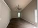 Large bedroom featuring new hardwood floors, neutral walls, and a modern ceiling fan at 3718 Jackson Bluff Dr, Lawrenceville, GA 30044