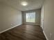 Well-lit bedroom features new flooring and neutral paint at 3718 Jackson Bluff Dr, Lawrenceville, GA 30044