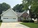 Charming single-Gathering home with well-maintained lawn and two car garage at 3718 Jackson Bluff Dr, Lawrenceville, GA 30044