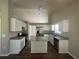 Well-appointed kitchen featuring white cabinets, stainless steel appliances, granite countertops, and a functional island at 3718 Jackson Bluff Dr, Lawrenceville, GA 30044
