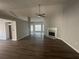 Bright living room featuring a marble fireplace, high ceilings, and modern ceiling fan at 3718 Jackson Bluff Dr, Lawrenceville, GA 30044