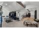 Attic featuring black metal racks, a lounge seat, and gray carpet flooring at 6305 River Chase Cir, Atlanta, GA 30328