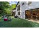 Spacious backyard with turf, seating, and grilling area, ideal for outdoor entertaining at 6305 River Chase Cir, Atlanta, GA 30328