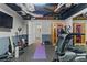 Finished basement featuring exercise equipment, an infrared sauna, and a television at 6305 River Chase Cir, Atlanta, GA 30328