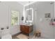 Modern bathroom with glass shower, white subway tile, and floating vanity with vessel sink at 6305 River Chase Cir, Atlanta, GA 30328