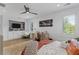 Airy bedroom with built-in shelving, plantation shutters, and modern ceiling fan at 6305 River Chase Cir, Atlanta, GA 30328