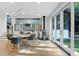 Bright dining space with sliding glass doors, modern lighting, and an open view to living room at 6305 River Chase Cir, Atlanta, GA 30328