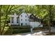Two-story home featuring a blend of brick and painted siding and landscaped front yard at 6305 River Chase Cir, Atlanta, GA 30328