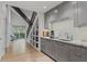 Bright hallway with built-in cabinets, a sink, and a staircase at 6305 River Chase Cir, Atlanta, GA 30328