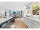 Bright, open kitchen with modern island seating, stainless steel appliances, and access to dining area at 6305 River Chase Cir, Atlanta, GA 30328