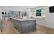 Spacious kitchen with a large center island, marble countertops, and modern appliances at 6305 River Chase Cir, Atlanta, GA 30328