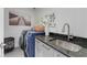 Well-appointed laundry room with modern appliances, a sink, and ample counter space at 6305 River Chase Cir, Atlanta, GA 30328