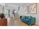Bright living room with staircase, features stylish furniture, artwork, and hardwood floors at 6305 River Chase Cir, Atlanta, GA 30328