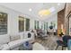 Bright living room featuring a skylight, many windows, hardwood floors, and a seating area at 6305 River Chase Cir, Atlanta, GA 30328