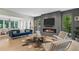Modern living room with hardwood floors, modern furniture, and a linear fireplace at 6305 River Chase Cir, Atlanta, GA 30328