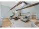 Bright living room with wood beams, skylights, hardwood floors, and comfortable seating at 6305 River Chase Cir, Atlanta, GA 30328