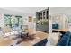 Inviting living room featuring a bar area, hardwood floors, and a walkout to the patio at 6305 River Chase Cir, Atlanta, GA 30328