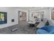 Contemporary living room featuring gray sofa, blue accent chair, and modern design at 6305 River Chase Cir, Atlanta, GA 30328