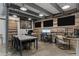 Bright office with multiple monitors, wood wall, concrete floor, and work space at 6305 River Chase Cir, Atlanta, GA 30328
