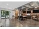 Office with wood accent wall, table and chairs, dual French doors, and polished concrete floors at 6305 River Chase Cir, Atlanta, GA 30328