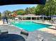 Outdoor pool with lounge chairs and picnic umbrellas on a bright day at 6305 River Chase Cir, Atlanta, GA 30328