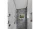 Contemporary shower with dual shower heads and textured gray tile at 6305 River Chase Cir, Atlanta, GA 30328