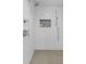 Modern shower with subway tile walls, rainfall shower head, and a built-in niche at 6305 River Chase Cir, Atlanta, GA 30328