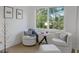 Cozy sitting area features natural light, with comfortable seating and a view to the outside at 6305 River Chase Cir, Atlanta, GA 30328