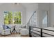 Cozy sitting area with natural light, featuring elegant chairs and a view to the outside at 6305 River Chase Cir, Atlanta, GA 30328