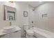 Clean bathroom with modern vanity, shower-tub combo, and stylish finishes at 2244 Alpha Dr, Decatur, GA 30032