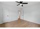 Neutral bedroom with fan, closet, and wood floors at 2244 Alpha Dr, Decatur, GA 30032