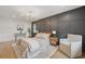 Spacious bedroom featuring wood floors, decor wall and stylish furniture at 2244 Alpha Dr, Decatur, GA 30032