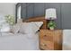 Relaxing bedroom features a wood headboard, custom nightstand and stylish lamp at 2244 Alpha Dr, Decatur, GA 30032