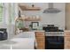 Stylish kitchen featuring modern appliances, and open shelving at 2244 Alpha Dr, Decatur, GA 30032